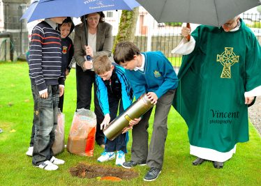 Burying the time capsule in the grounds of St Patricks church | Vincent Kerrigan